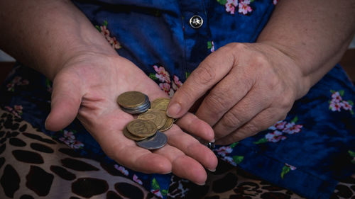 Midsection of woman holding money