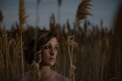 Close-up of woman standing in field