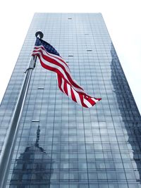 Low angle view of flag against building