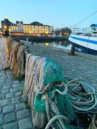 Fishing net on river against sky in city
