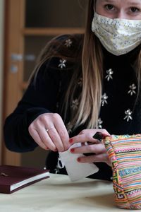 Full length portrait of a girl wearing mask