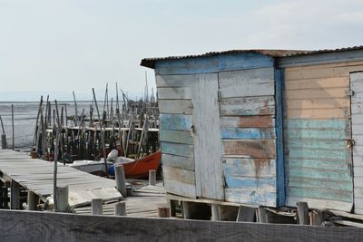 View of built structure by sea