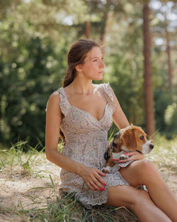 Portrait of young woman with dog