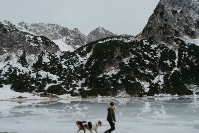 People standing on snow covered mountain