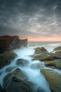 Scenic view of sea against sky during sunset