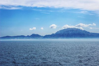 Scenic view of sea against blue sky