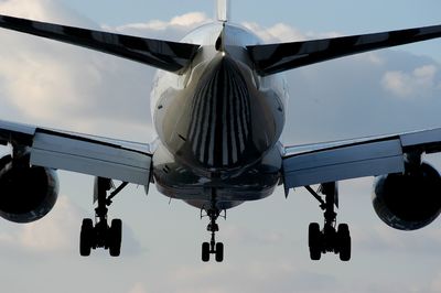 Low angle view of airplane against sky