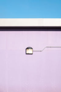 Light against purple wall