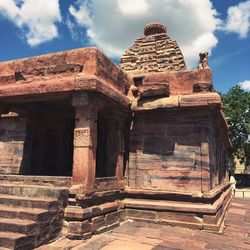 Old ruins of temple against cloudy sky