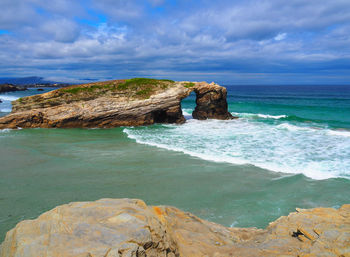 Scenic view of sea against blue sky