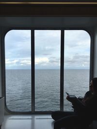 Scenic view of sea seen through window