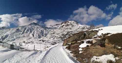 Scenic view of snowcapped mountains against sky