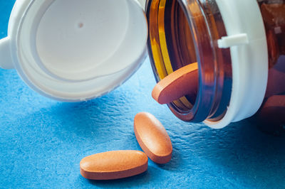High angle view of pills and medicines on table