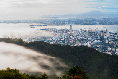 Aerial view of cityscape against sky