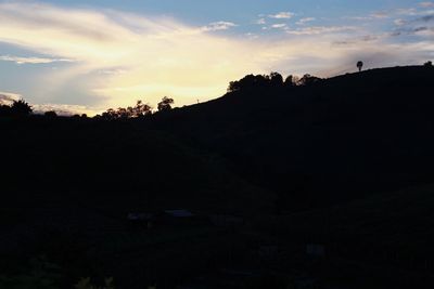 Silhouette landscape against sky during sunset