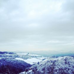 Scenic view of snow covered mountain against sky