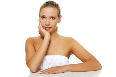 Portrait of a beautiful young woman over white background