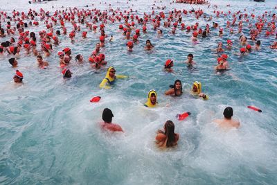 High angle view of people swimming in pool