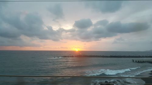 Scenic view of sea against sky during sunset