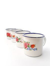 Close-up of tea cup against white background