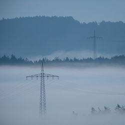 Electricity pylon against sky