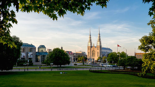 Buildings in city against sky