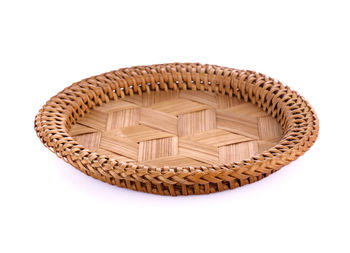 Close-up of wicker basket on white background