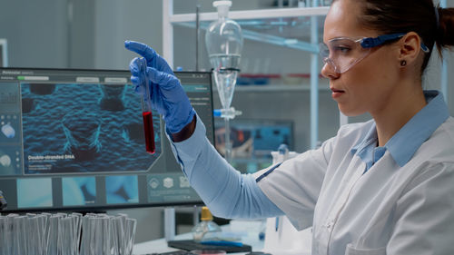 Female scientist experimenting in laboratory