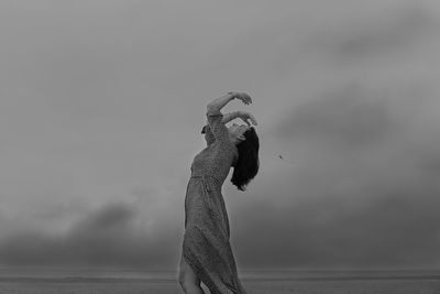 Woman dancing on the beach