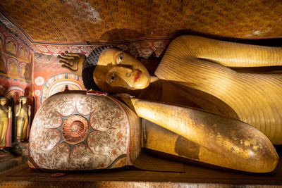 Low angle view of buddha statue in temple