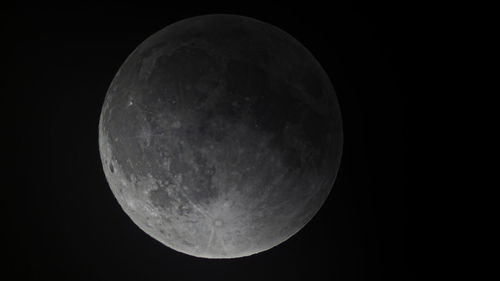 Low angle view of moon against sky at night