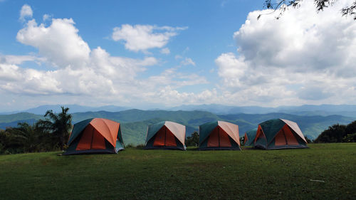 Tent on field against sky