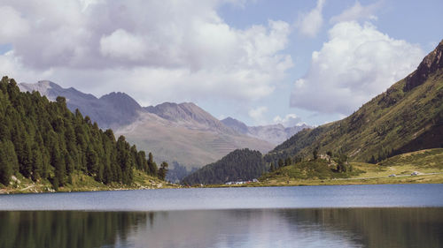 Scenic view of lake and mountains against sky