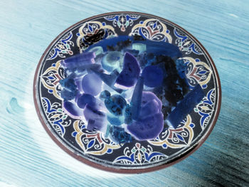 Close-up of blue plate on table