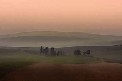 Scenic view of landscape against sky during sunset