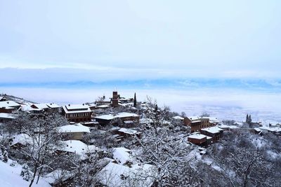 View of cityscape against sky during winter