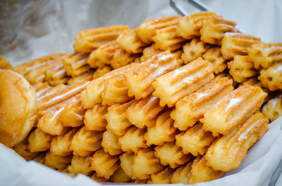 View of baked sticks dusted with powdered sugar