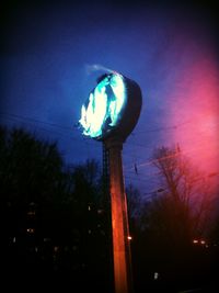 Low angle view of illuminated lights at night