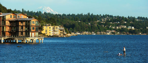 High angle view of man paddleboarding in sea