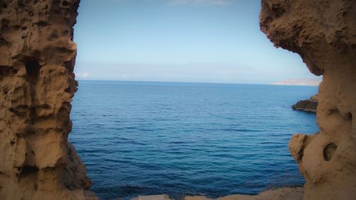 Scenic view of sea against blue sky