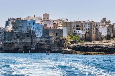 Polignano a mare seen from the sea. cliffs and caves