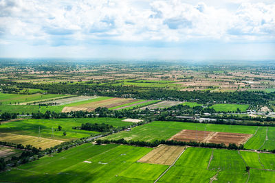 Aerial view of agricultural landscape against sky