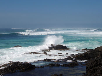Ocean waves for surfing in the sea at the coastal line