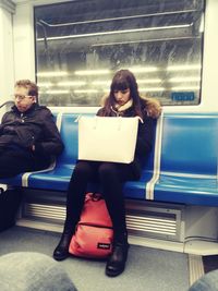 Young couple sitting in train