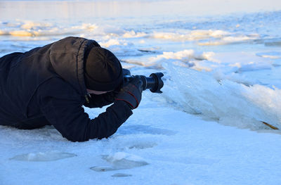 Man photographing nature in winter