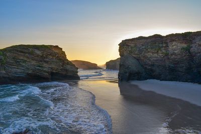 Scenic view of sea against clear sky during sunset