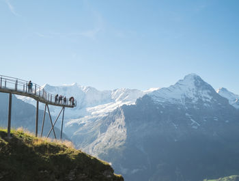 Scenic view of mountain range against clear blue sky