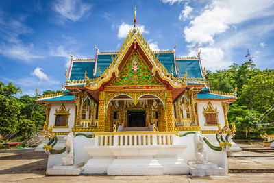 View of temple building against cloudy sky