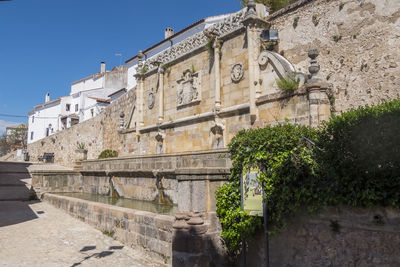 Low angle view of old ruins against clear sky
