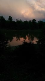 Scenic view of calm lake against sky